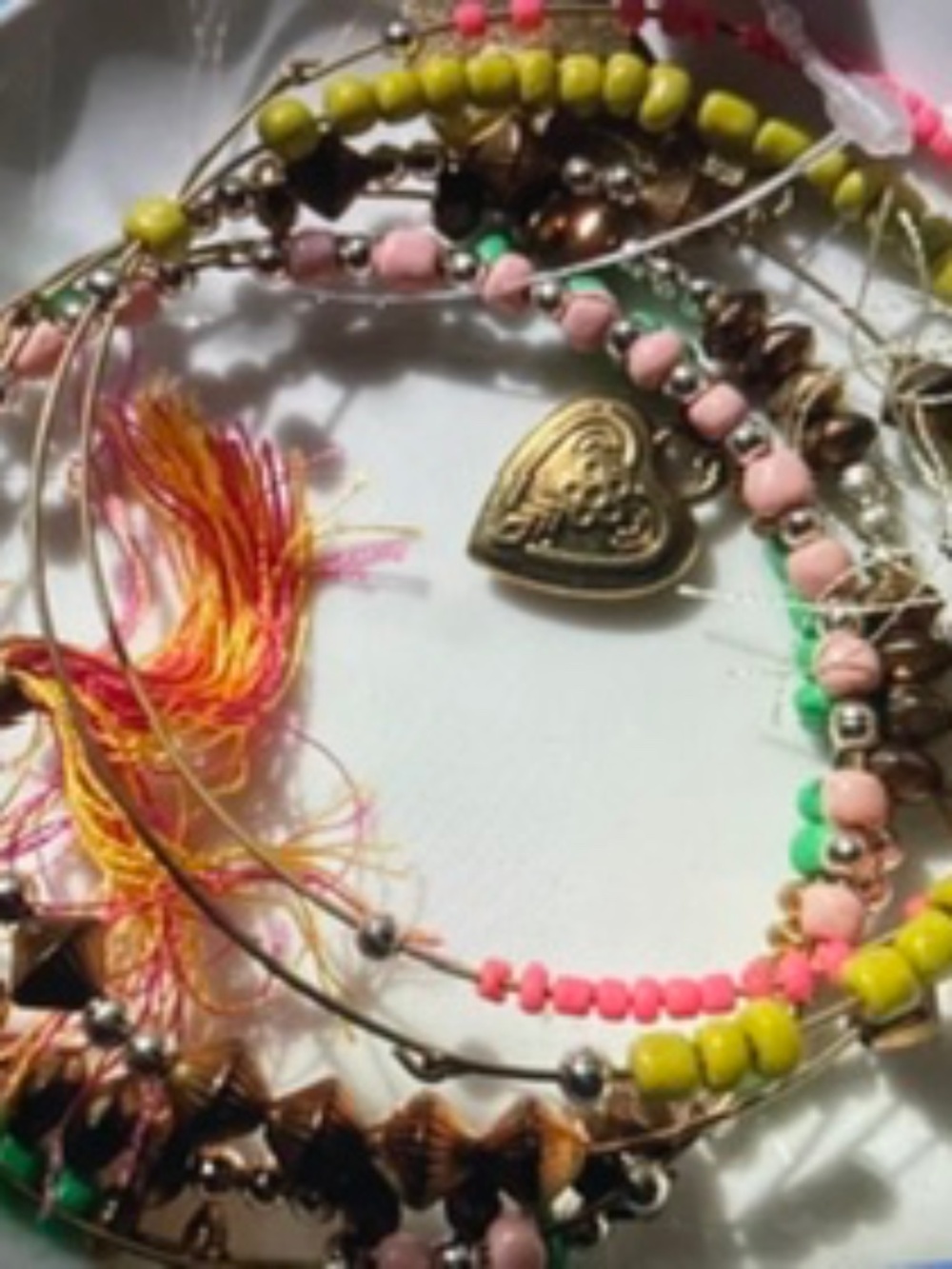 Bohemian-style multicolored bangle bracelets: beads, tassels, metallic charm (5)